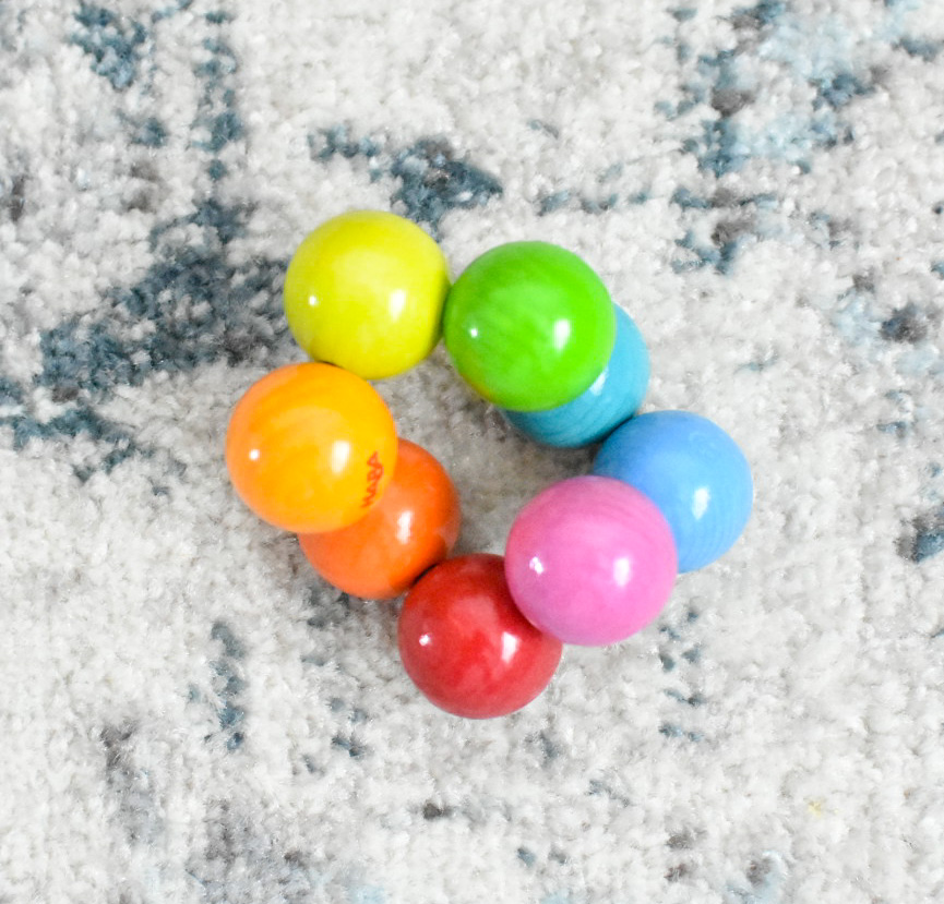 The image shows a multicolored grasping ball.